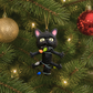Shocked Black Cat Wrapped in Lights Ornament