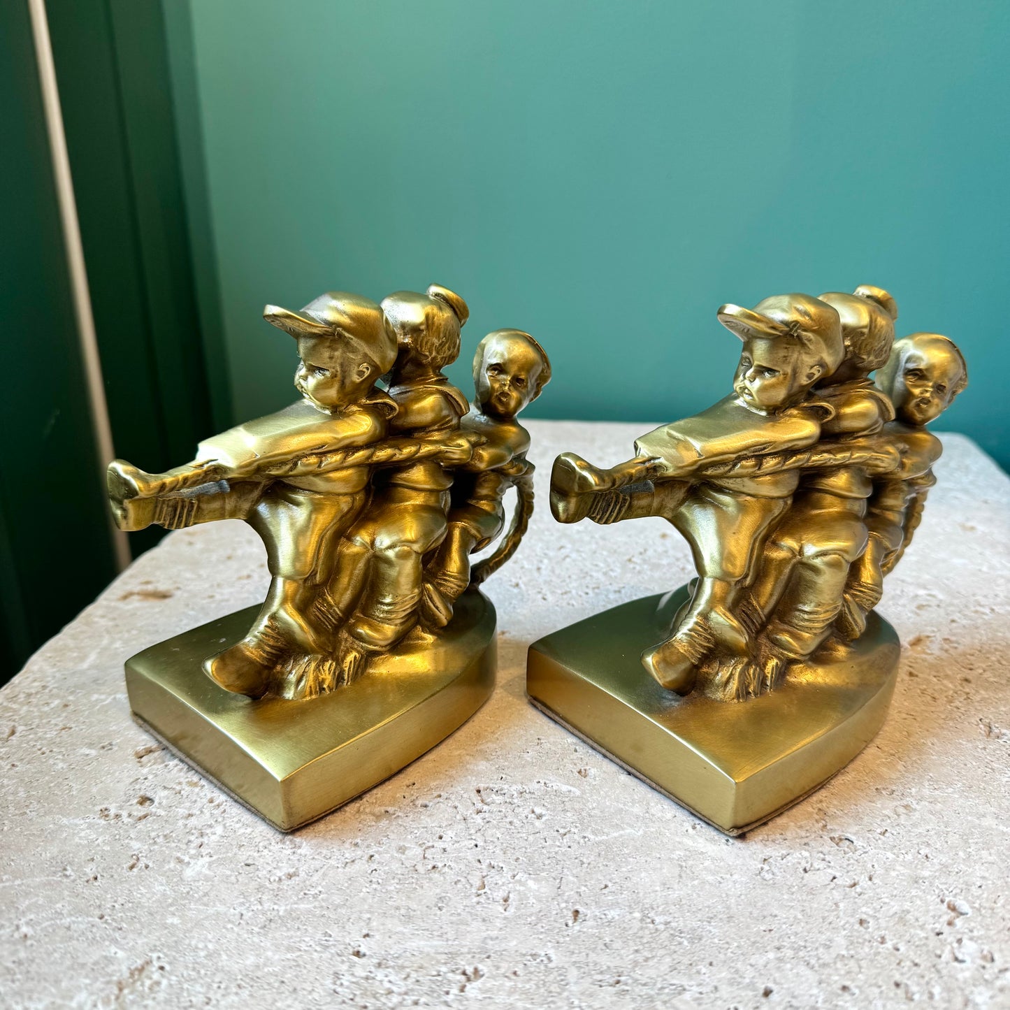 Pair of Vintage Mid Century Brass “Tug of War” Bookends