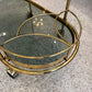 Vintage Oval Brass and Smoked Glass Rolling Bar Cart