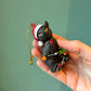 Black Cat with Santa Hat Wrapped in Lights