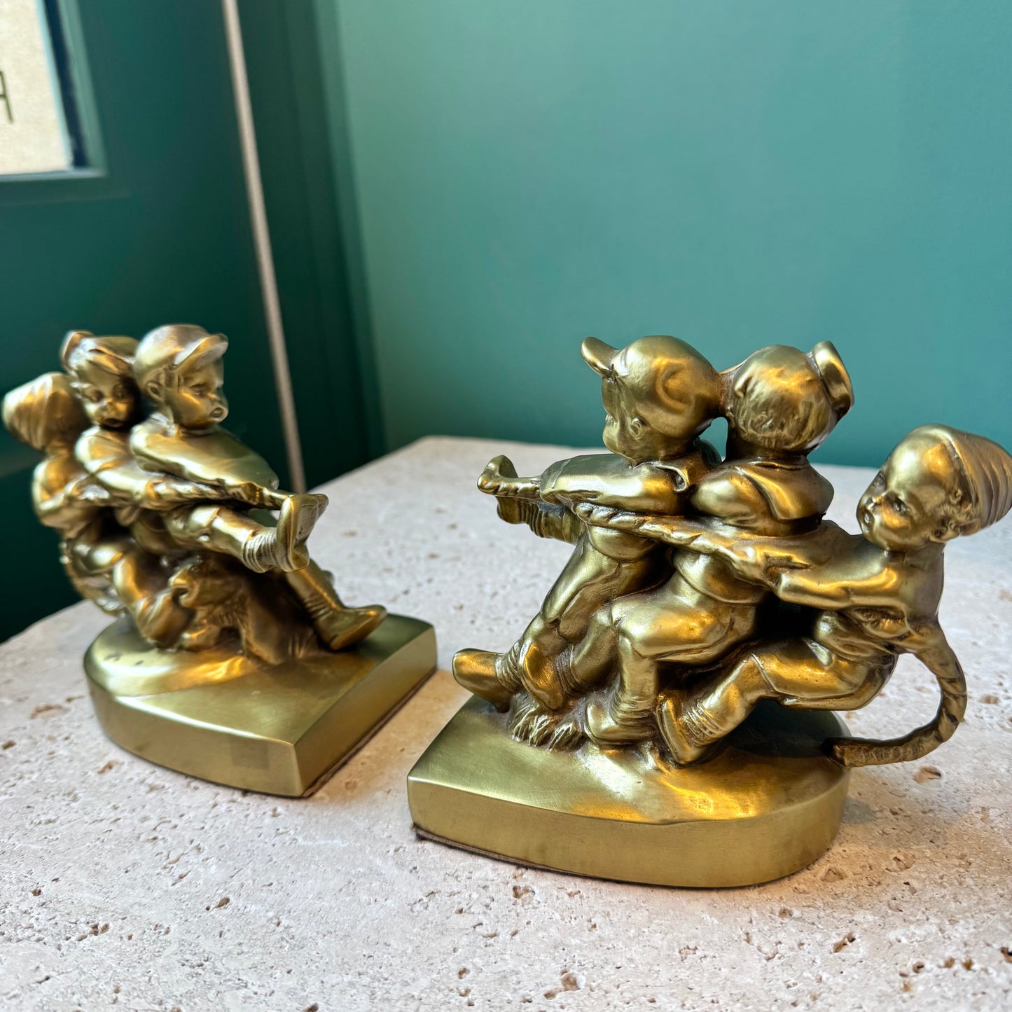 Pair of Vintage Mid Century Brass “Tug of War” Bookends