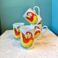 Vintage 1979 Fitz & Floyd "Parrot-in-Ring" Ceramic Coffee Mugs - Set of 4