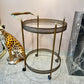 Vintage Mid Century Round Brass and Glass Rolling Bar Cart