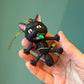 Shocked Black Cat Wrapped in Lights Ornament