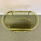 Vintage Oval Brass and Smoked Glass Rolling Bar Cart